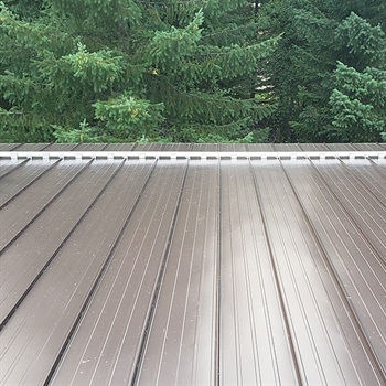 Color Snap® Snow Rail System installation for snow rails on metal roofs