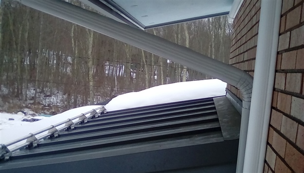 Homeowner chose AceClamp 2-bar snow guards to prevent the snow avalanche