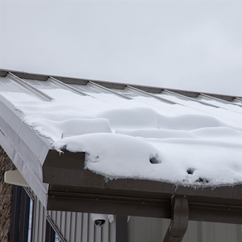 Metal roof snow rails mounted on metal roof at GCI Outdoors
